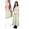 Conjunto completo de outfit estilo coreano para mujer, nueva colección otoño e invierno, conjunto de dos piezas de suéter de punto pesado con lazo y falda, moderno