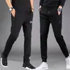 Pantalones casuales gruesos para hombre de primavera y otoño, joggers deportivos holgados de cintura alta de corte slim versátiles con cremallera y perneras rectas