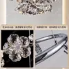 NEIWAI, um luxuoso lustre de cristal com intrincados desenhos florais, perfeito para salas de estar, vilas e salões principais, apresentando um sofisticado design de anel redondo e uma estrutura de metal