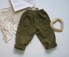 Pantalones Infantiles Estilo Coreano Otoño 2026 Pantalones de Nueve Puntos para Niñas Primavera Pantalones Cargo Versátiles de Color Sólido para Niños Moda Primavera Verano