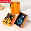 Chaveiro de anel de aperto criativo transfronteiriço para alívio de estresse, mini treinador de dedos colorido, dispositivo de aperto para alívio de estresse, pingente de mochila