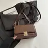 Bolso pequeño cuadrado tejido 2026 nuevo bolso de hombro de moda bolso simple para mujer bolso de mano pequeño bolso de mujer de comercio exterior bolso cruzado