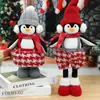Decoração de Natal transfronteiriça, pinguim em pé com cachecol, chapéu e pernas retráteis, enfeite de festa fofo em desenho animado