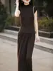 Vestido de Moda sem Mangas Estilo Francês para Mulheres 2026 Novo Modelo Camisa Base de Tricô sem Mangas + Saia Midi Evasê Tendência