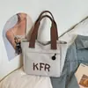 Bolsa de Lona de Gran Capacidad para Mujer, Nueva Tendencia Primavera 2026 Bolso Versátil para la Clase y el Trayecto Bolsa Tote