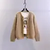 Estilo perezoso coreano suelto, abrigo suéter, nuevo estilo Otoño e Invierno 2025, elegante y moderno, color liso, tejido grueso