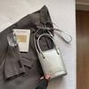 Bolso Cubo de Mano de Alta Gama Estilo Coreano Modelo Nuevo 2026 Bolso Cruzado de Hombro Simple Bolso Pequeño Casual Retro