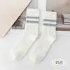 Calcetines pantufla para hombre forrados de felpa deportivos dos rayas 40-45 tallas calcetines de felpa coral de invierno transfronterizos Amazon