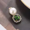 Versión coreana de horquilla verde clip de strass perla de lujo ligero clip lateral rojo en línea para mujer clip de pico de pato tocado al por mayor