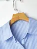 Nova Jaqueta Camisa de Manga Longa Azul Listrada com Gola Polo Estilo Europeu e Americano Transfronteiriça para Mulheres, Novo Modelo Primavera e Outono 2026, Caimento Regular nos Ombros