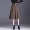 Saia midi evasê lisa e elegante para mulheres, nova coleção outono 2026, cintura alta, disfarça a barriga, corte solto, casual e com barra larga