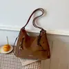 Outono de 2026 novo vintage de alta qualidade moda versátil feminina de grande capacidade dupla alça, alça única, transversal bolsa atacado bolsas femininas