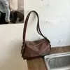 Bolsa Baguete de Nicho Estilo Coreano de Alto Valor para Mulheres Verão 2026 Nova Moda Minimalista Cor Sólida Bolsa de Ombro Único para Sobrancelha