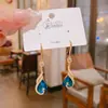 Otoño e Invierno Versátil Clásico Elegante Versátil Pendientes de Borla de Cristal Azul Pavo Real Pendientes Elegantes de Gama Alta Retro