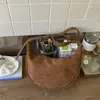 Bolsa feminina moderna com estampa de leopardo, bolsa casual de nicho de alto valor para mulheres, nova bolsa de ombro retrô para o trabalho de nicho 2026