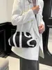 Bolso de Diseño de Nicho Transfronterizo 2026 Nuevo Bolso de Cadena Bolso de Hombro de Moda Rayado Bolso Cruzado de Gran Capacidad para Mujer