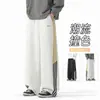 Pantalones de chándal a rayas personalizados/estilo americano, nueva colección de otoño, corte holgado, efecto de caída, bordado en bloques de color, versátiles para deportes y uso casual