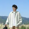 Nueva colección de primavera y otoño: camisa de manga larga texturizada, estilo unisex, corte holgado, con cuello y bolsillos, prenda exterior moderna y casual