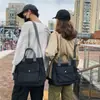 Bolso de Hombro para Mujer y Hombre 2026 Nueva Moda Nicho Color Sólido Bolso de Clase para Estudiantes Gran Capacidad Lona Casual Bolso Cruzado