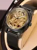 Reloj de lujo para hombre más vendido transfronterizo con relieve dorado, esfera calada a doble cara y correa de cuero con números romanos
