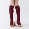 Calcetines altos hasta la rodilla de cachemira para otoño e invierno para mujer con lazo, calcetines largos versátiles adelgazantes a juego con botas cálidas engrosadas