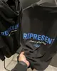 Camiseta Casual Solta de Manga Curta com Estampa de Slogan Icônico High Street para Mulheres e Homens