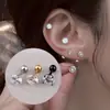 Aretes de botón redondos de zirconia de cuatro puntas soldada al por mayor para mujer, joyería para perforación corporal de acero inoxidable estilo coreano, pequeños tachuelas en espiral estilo Chanel