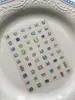 Nuevas pegatinas de arte de uñas coloridas y sencillas de terrón de azúcar con respaldo adhesivo, estrellas láser iridiscentes y pegatinas de decoración de uñas aurora al por mayor