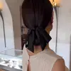 Elegante Moño Bajo con Lazo Negro de Satén Pinza de Resorte Accesorio para el Cabello 2025 Nuevo Estilo Pinza para Cola de Caballo para Mujeres