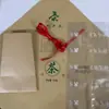 Empaque Hecho a Mano de Papel Kraft West Lake Lion Peak Longjing Papel Kraft con Bolsa Interior Bolsa de Plástico Cuerda Roja 250g