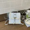 Mochila casual versátil de nicho com laço para mulheres, novo modelo 2026, bolsa escolar fofa estilo universitário, mochila de viagem
