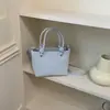 Bolsa Saco Versátil e Fashion para Mulheres 2026 Verão Novo Estilo Bolsa de Mão Texturizada Bolsa de Ombro Transversal Design de Nicho para o Dia a Dia