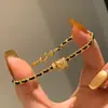Anillo Corredor Dorado de Explosiones de Libro de Caperucita Roja Pulsera de Oro Negro Cadena Estilo Chanel Simple y a la Moda para Mujer Cuerda de Mano Trenzada Flash Cepillada