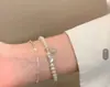 Pulseira de Pérolas Prateadas Ultra Fina para Mulheres 2026 Novo Estilo Alto Padrão Luxo Leve Nicho Exquisito Pulseira Empilhável Acessório