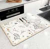 Venta al por mayor de fábrica tapete de drenaje mesa de lavado de cocina mesa de comedor mesa de bar tapete de mesa absorbente resistente al desgaste antideslizante lodo de diatomeas se puede usar para cabello