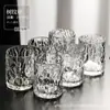 Conjunto de copos de vidro resistentes ao calor para uso doméstico, apresentando um design simples, moderno e elegante, incluindo copos de vidro, copos de água e taças de vinho, todos em cor transparente