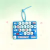 Teclado de dibujos animados lindo de 26 teclas, juguete para aliviar el estrés, colgante de llavero decorativo, venta al por mayor
