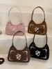 Otoño e invierno 2026 bolso de mano fresco, bandolera, bolso versátil para el trabajo, bordado retro de trébol de cuatro hojas y nota musical, bolso artístico para mujer