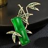 Novo high-end estilo nacional clássico retro Jade bambu broche elegante clássico elegante planta corsage acessórios femininos atacado