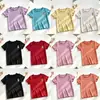 Nova coleção de verão: Camisetas de manga curta para meninas, camisolas de manga curta de seda gelada e blusas estilosas com acabamento em renda para bebês meninas