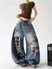Jeans Azuis Rasgados Feminino Masculino 2026 Verão Novo Estampa de Letras Perna Larga Longo Casual Calças Xintang Fronteira Estoque