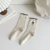 Calcetines de oreja de madera para mujer, calcetines de primavera y otoño, encaje enrollado, lazo, estilo ins simple, versátiles, calcetines de estudiante acanalados