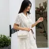 Agente de Compras de Hong Kong 2025 Bolso de Mano para Mujer de Cuero Genuino Nuevo, de Nicho, Gama Alta, Elegante, Bolso Pequeño Cruzado con Textura Versátil