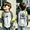 Camiseta base de forro polar alemán de doble cara para niño otoño e invierno estilo coreano prenda superior camiseta base capa interior cuello redondo bloques de color de dibujos animados manga larga