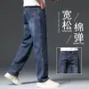 Jeans azul de alta qualidade para outono masculino, calças casuais retas soltas, perna larga, plus size, calças elásticas para primavera e outono