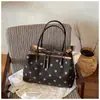 Bolso de mano de lona con lunares de gran capacidad para mujer, nuevo modelo 2026, de alta gama, lujo ligero, bolsa tote de nicho para el trabajo