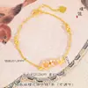 Tienda de oro con arena de oro flor de doce dioses flor de cerezo lluvia colgante binaural pulsera ajustable romántico accesorios de joyería de flores