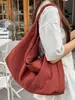 Bolsa de tela de gran capacidad, versátil, ligera, estilo perezoso, para el día a día, 2026, nuevo, color sólido, textura, moda, bolso de axila/hombro
