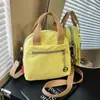 Nova bolsa de ombro minimalista e estilosa, uma bolsa tote de lona versátil para uso diário, deslocamento, compras e pode ser usada como bolsa transversal.