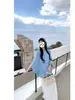 Verano 2026 nuevo estilo manga murciélago cuello redondo holgado adelgazante versátil moderno de manga corta tejido para mujer con un toque de alta gama